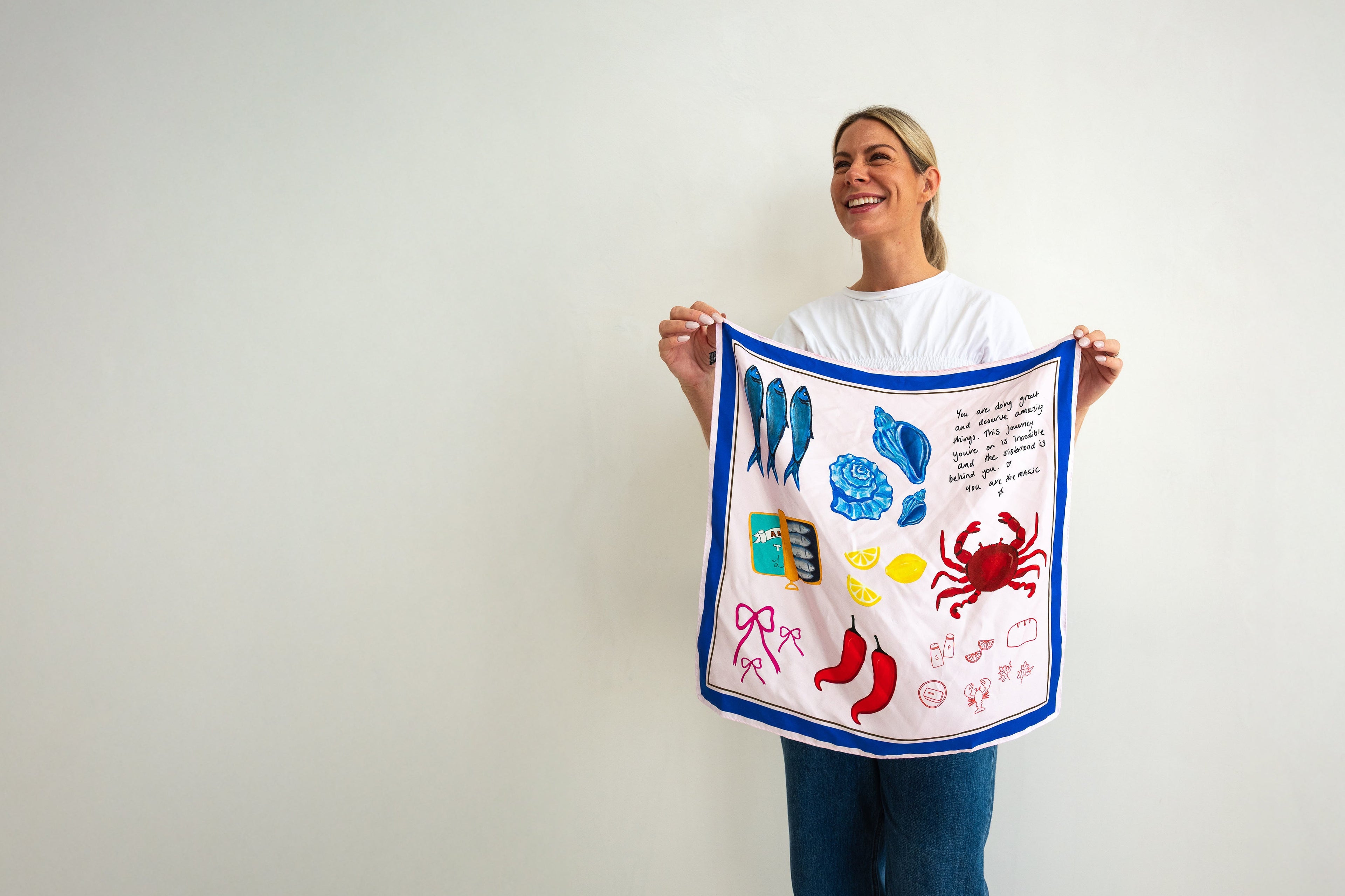 person holding colourful silk scarf